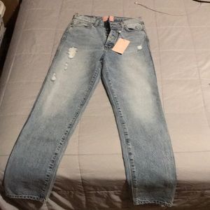 Distressed denim jeans